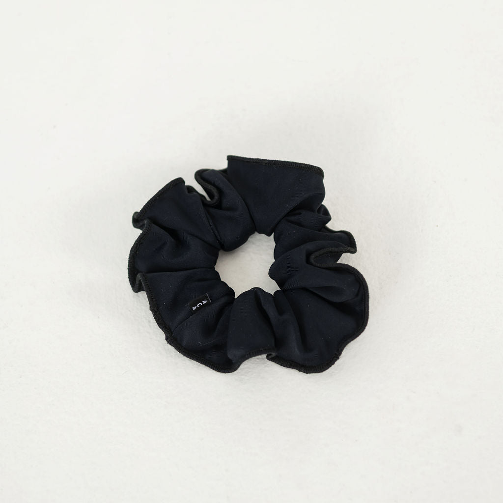 The Scrunchies 2 Pack, featuring black fabric scrunchies ideal for ballet hair ties or dancer accessories, is displayed on a plain white surface.