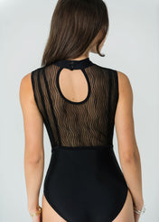 Rear view of the Eden Bold black leotard showing the sheer wavy mesh back and keyhole opening.
